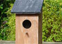 Birdhouse with wood roof