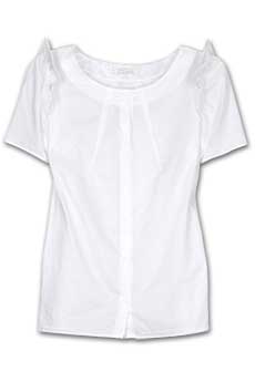 White cotton blouse with ruffle detailing on the shoulder.