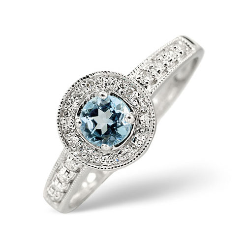 0.12 Ct Diamond and Blue Topaz Ring In 9 Carat White Gold