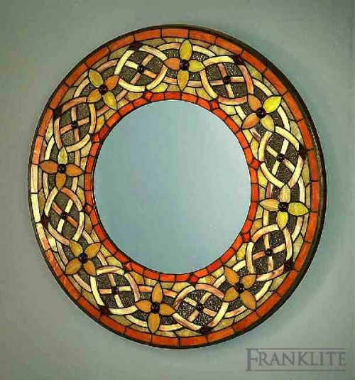 A circular mirror with our exclusive tiffany glass around the edge