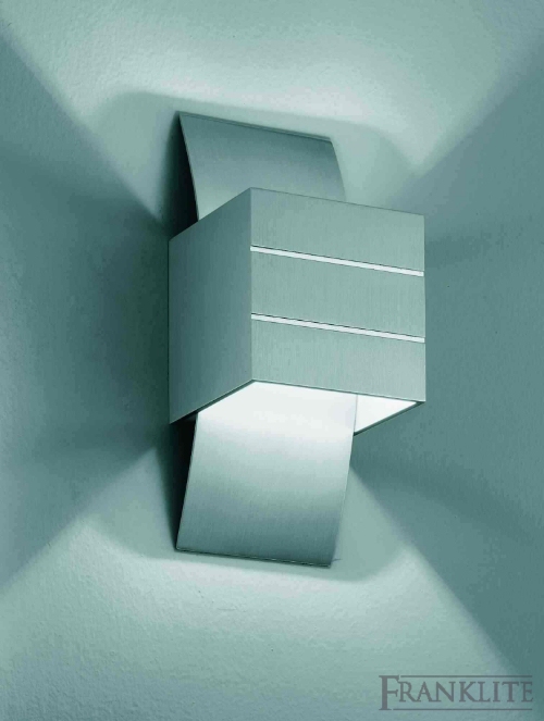 Brushed aluminium wall brackets with mains voltage halogen lamps.