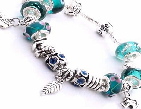 .. Pandora style silver plated charm bracelet with African Animal theme. Turquoise, Green, Blue beads... Elephants, Lion, Giraffe, Turtle, Snake and feather charms & clipstopper..The brace