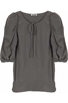 Anthracite silk blouse with bib front and three quarter length balloon sleeves.