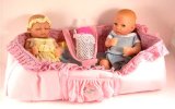 RSC Extremely cute boy and girl twin dolls complete with carry cot and extra clothes
