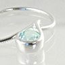 Tear drop Silver pendant set with blue Topaz
