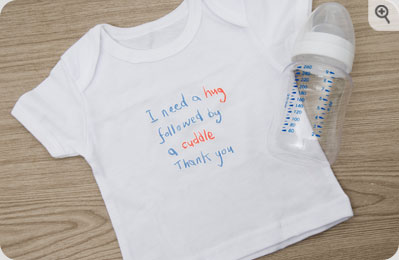 Unbranded ` Need A Hug`Baby T-shirt in a Bottle