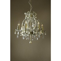 This large stunning cream cracked chandelier has clear crystals covering the frame with milky white 