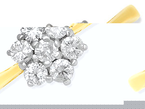 Seven diamonds (1/2ct total diamond weight) together create this lovely cluster ring with narrowed 1