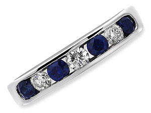 Four blue sapphires and three diamonds (1/4ct total diamond weight) are channel set in 18ct white go