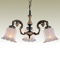 Solid antique brass fitting with delicate metal leaf design combined with cream glass with amber lip