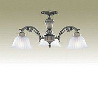 Antique brass fitting with delicate metal leaf design combined with fluted edged frosted glass shade