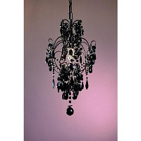 This is another one of our smaller stylish chandeliers it has a thin black frame and then covered wi