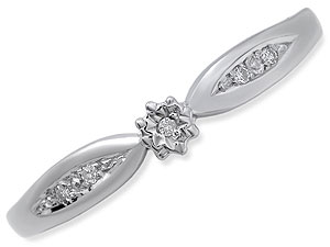 `Like a dragon-fly on the wing, this pretty 9ct white gold ring has a central circular diamond, and 