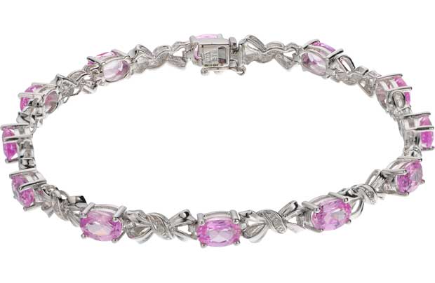This stunning 9ct white gold bracelet designed with delicately placed bow shaped diamonds and precious pink sapphire stones makes a gorgeous gift for someone special. The simple