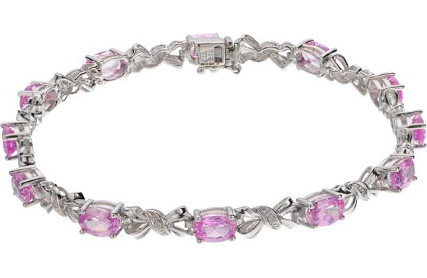 This stunning 9ct white gold bracelet designed with delicately placed bow shaped diamonds and precious pink sapphire stones makes a gorgeous gift for someone special. The simple