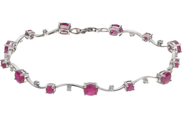 This stunning 9ct white gold bracelet designed with 10 delicately placed diamonds and precious ruby stones makes a gorgeous gift for someone special. The simple