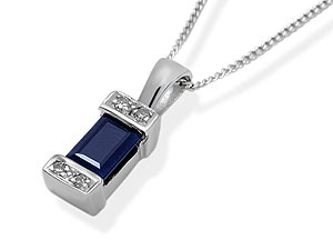 `A rectangular, blue sapphire is at the centre of this charming pendant, with two diamonds at either