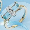 Blue topaz and diamond baguette design ring set in 9ct yellow gold.