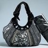 Gorgeous embellished slouch bag in a velvet style finish. Magnetic fastening. Other materials. 25H x