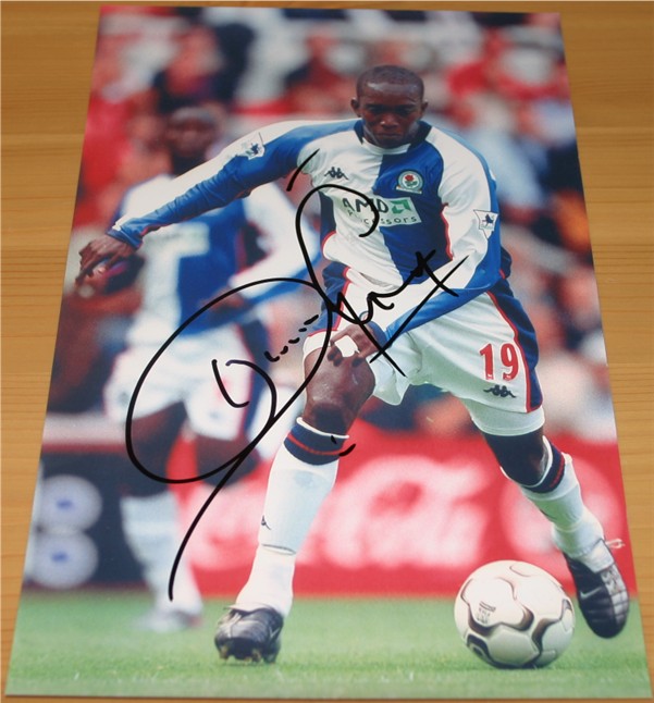Signed in black pen by former Blackburn Rovers striker Dwight Yorke. COA - 0420000497