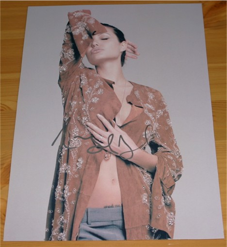 Gorgeous photo of a lovely lady signed clearly in silver pen. COA - 0120000068