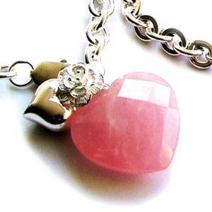Striking chunky Silver bracelet with faceted Rose Quartz Heart.  Matching necklace available