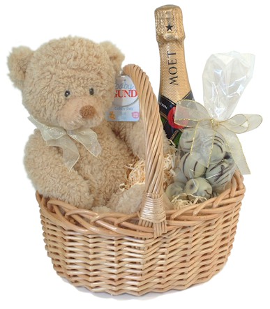 Isn`t this the most delightful little baby gift basket? The adorable baby bear by Gund Bears wears