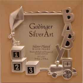 A beautiful satin finish silver plated wooden baby photo frame