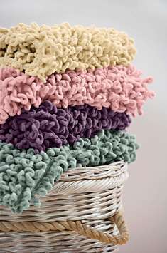 Chenille giant sized loop bath mats with a non-slip backing, available in three sizes and four colou