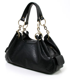 Large handbag with bronze hardware, popper fastening pockets and a zip closure central compartment. 