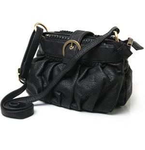 Small cross body bag with two separate zipped compartments secure by a flap over popper fastening wi
