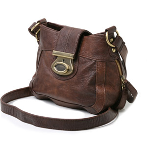 Small cross body bag with flap over push lock fastening. The Bemily bag features zipped side detail,