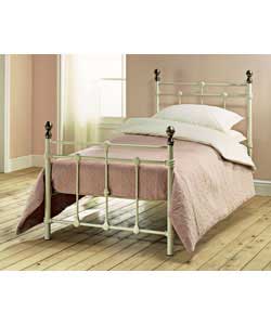 Ivory colour bedstead with antique brass colour finials.Metal frame.Luxury firm mattress.Overall