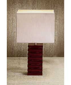 Dark wood ridged table lamp complete with cream shade.Height 33cm.Push bar switch.Requires 1 x 40