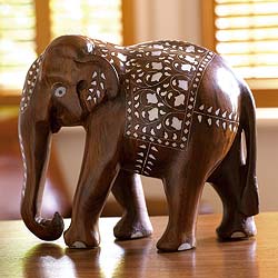 Our majestic hand-carved elephant is decorated in traditional Indian finery. He is beautifully made