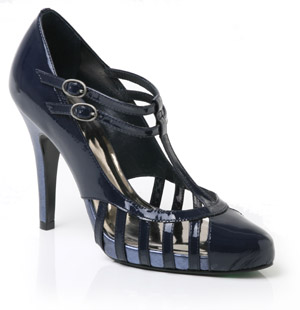 Patent leather court shoe featuring cut out detail and two buckled T-bar straps. With its high stile