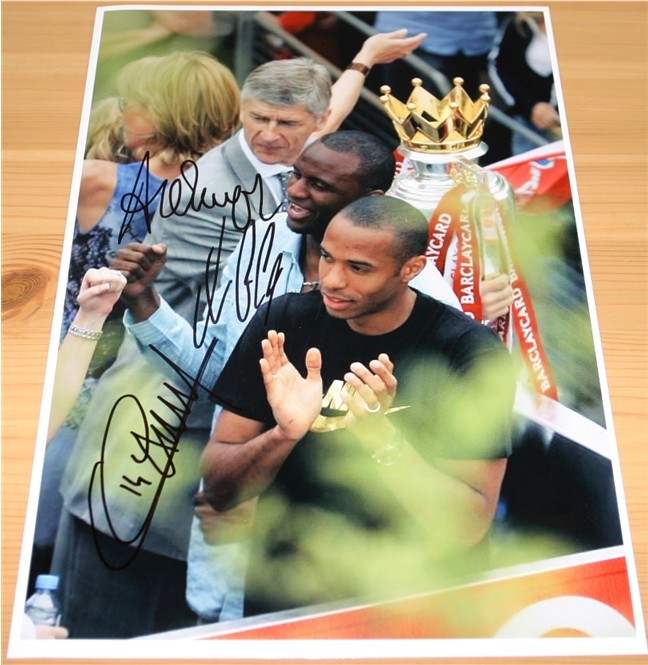 Great A4 photograph signed by Arsene Wenger  Patrick Vieira and Thierry Henry in black pen. COA -