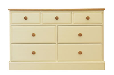 7 DRAWER EXTRA WIDE CHEST IN A DEVON CREAM PAINTED FINISH WITH SOLID OAK TOPS AND KNOBS. DOVETAILED 
