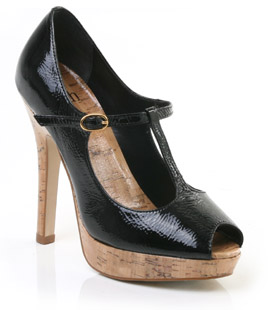 Patent leather court shoe with buckled T-bar strap and peep toe. The Cidney courts have a faux cork 