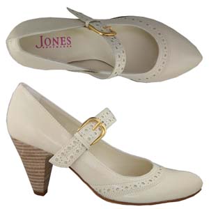 A fashionable Court shoe from Jones Bootmaker. Features brogue style design to the strap and front, 
