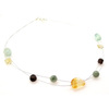 The luminescent gemstones strung across two wires on this necklace conjure up a celestial quality.