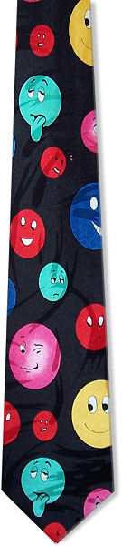 A fun tie with different coloured faces with different expressions on a black background