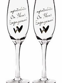 These Congratulations on your Engagement Pair of Champagne Glasses make a lovely gift for a happy couple celebrating engagement and the perfect place for them to toast and drink their champagne from!Each flute is made from clear glass and at the fron