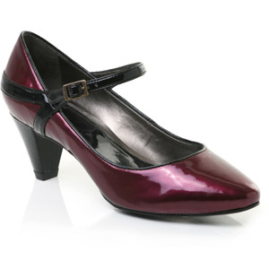 Pointed toe patent leather court shoe featuring buckled dolly strap and black piping detail. Perfect