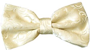 A cream coloured bow tie with an embossed leaf pattern