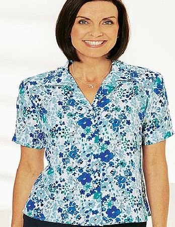 Cased elasticated neckline with tie. Bust darts. Side slits. Length 64cm (25 1/2in. approx.). 58 vis