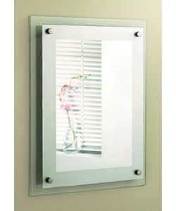 Rectangular mirror with a frosted frame. Sits on a glass panel so it appears to float; from the