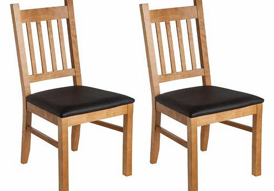 This pair of oak and black solid wood dining chairs comes from the Cucina collection. A sleek. classic design made from quality wood with a comfortable leather effect upholstered seat. Part of the Cucina collection Supplied as a pair. Seat height 47c
