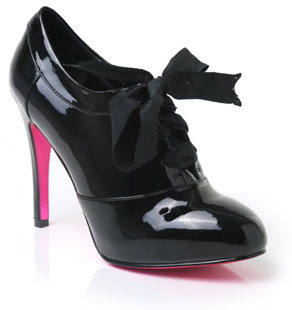 Patent shoe boot with ribbon lace up detail, almond toe and high stiletto heel. Sexy and stylish, th