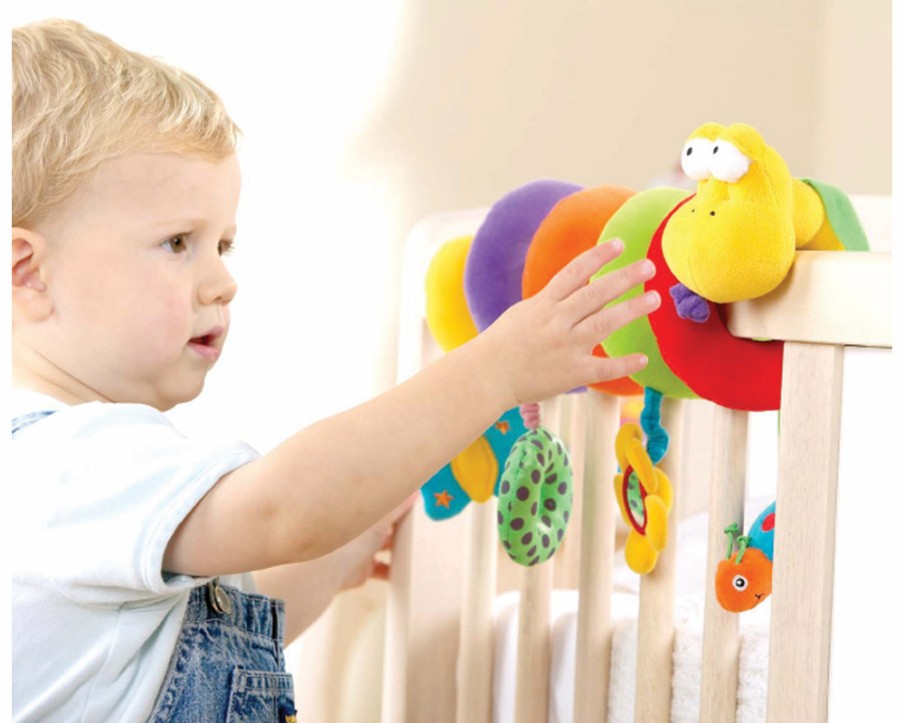 Crazy, curly and full of fun, this award, winning, colourful snake attaches to most strollers, cribs